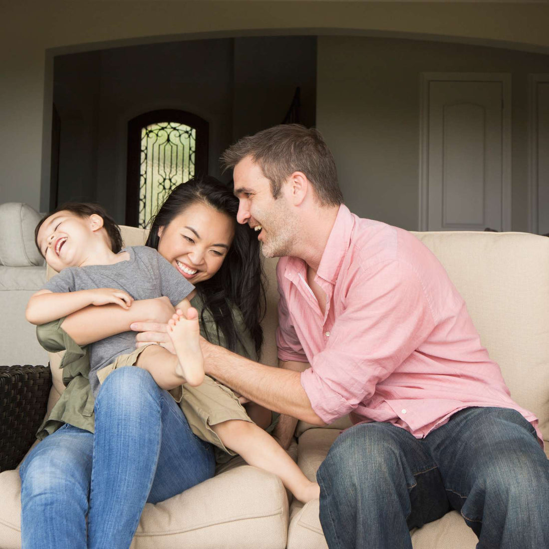A family a man and woman sitting side by side