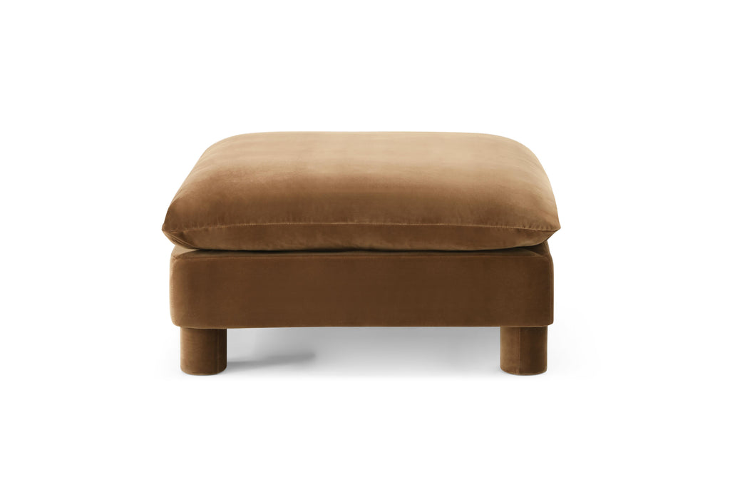 Family-friendly ottoman in modular seating setup

