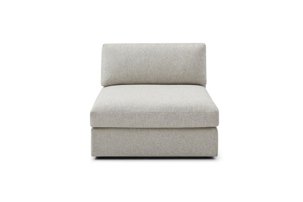 Halo ottoman with neutral tones and plush finish

